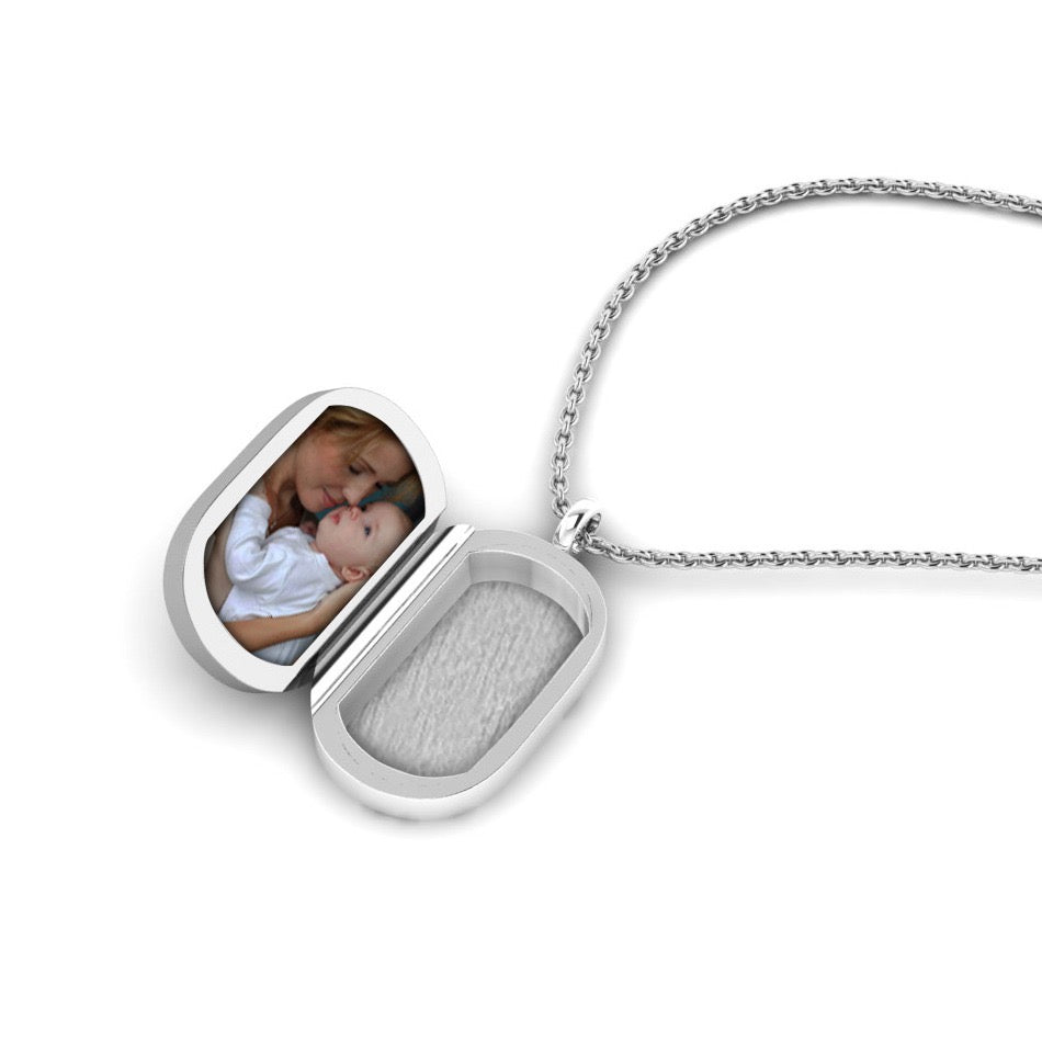 Gemstone locket featuring fabric from Elvis owns clothing with letter of authenticity