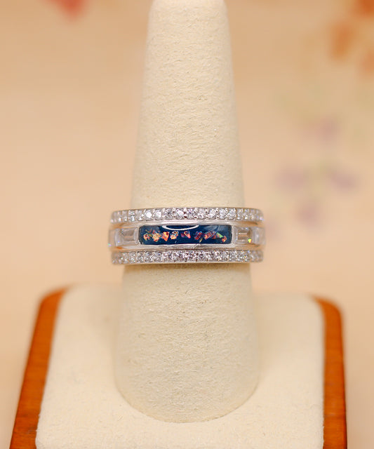 The queen's ring featuring fabric from Elvis owned clothing with letter of authenticity