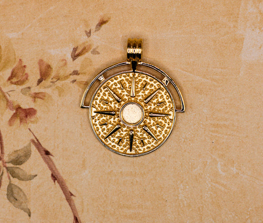 The Sun pendant featuring fabric from Elvis owned clothing with letter of authenticity