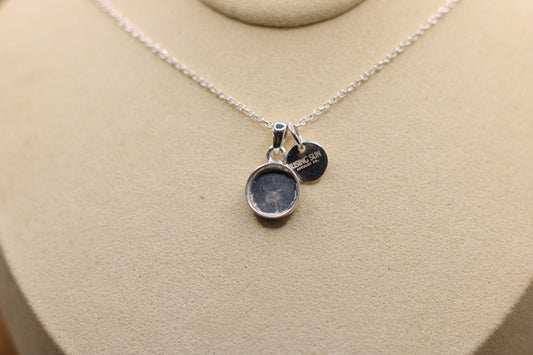 The Rising Sun pendant featuring fabric from Elvis owned clothing with letter of authenticity