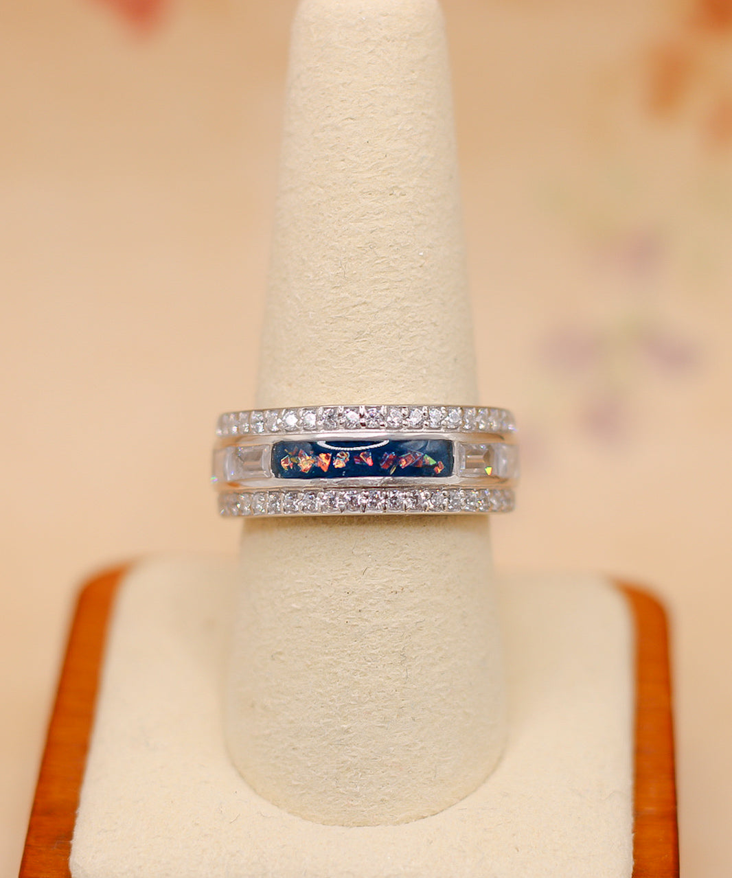 The queen's ring featuring fabric from Elvis owned clothing with letter of authenticity