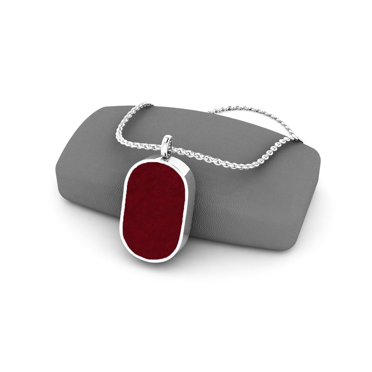 Gemstone locket featuring fabric from Elvis owns clothing with letter of authenticity