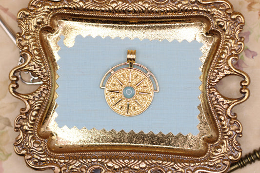 The Sun pendant featuring fabric from Elvis owned clothing with letter of authenticity